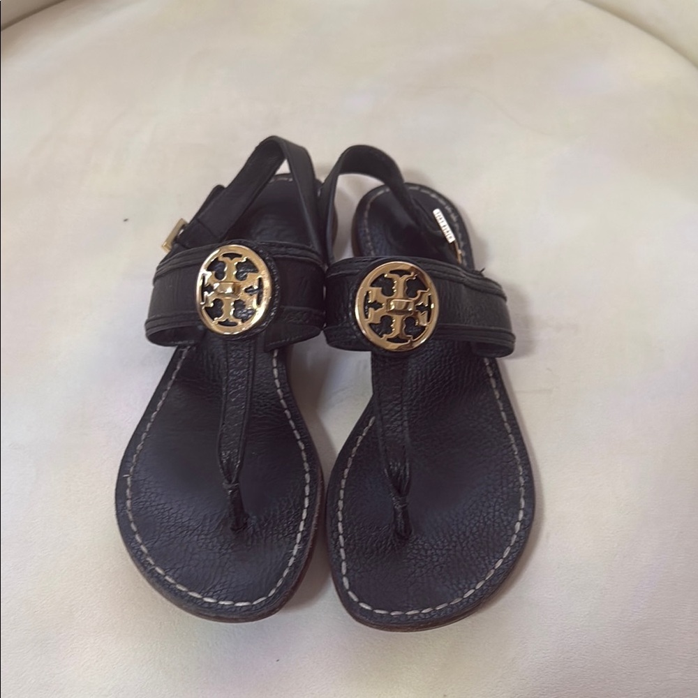 Tory Burch Black and Gold Sandals with Medallion Detail